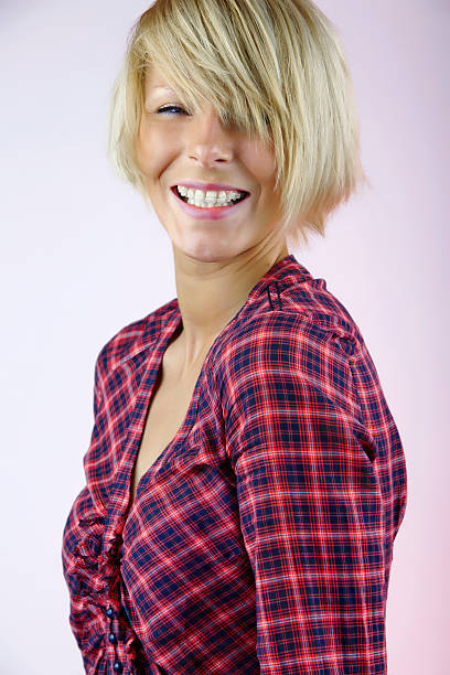 istock Young beautiful woman with braces smiling 182740574