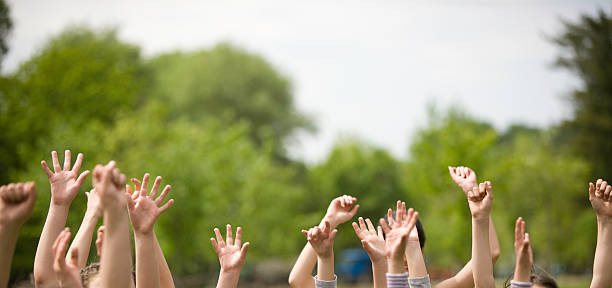 Children waving "Children waving, canon 1Ds mark III" kid waves stock pictures, royalty-free photos & images