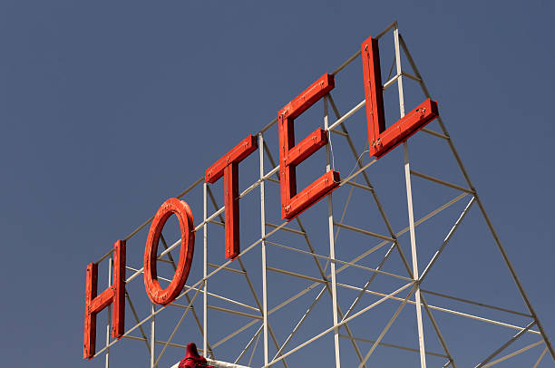 istock Giant Neon Rooftop Hotel Sign at Sunset 182740675