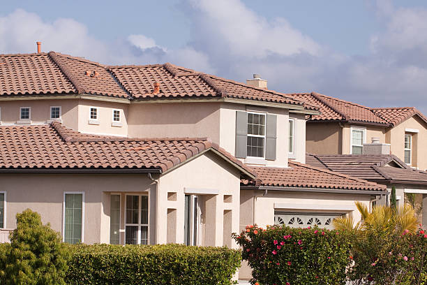istock Neighborhood Stucco Home Exterior and Sky 182740915