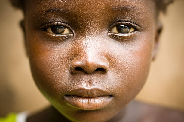 A portrait of an African girl with a sad expression A close up of an African girls face. developing countries photos stock pictures, royalty-free photos & images