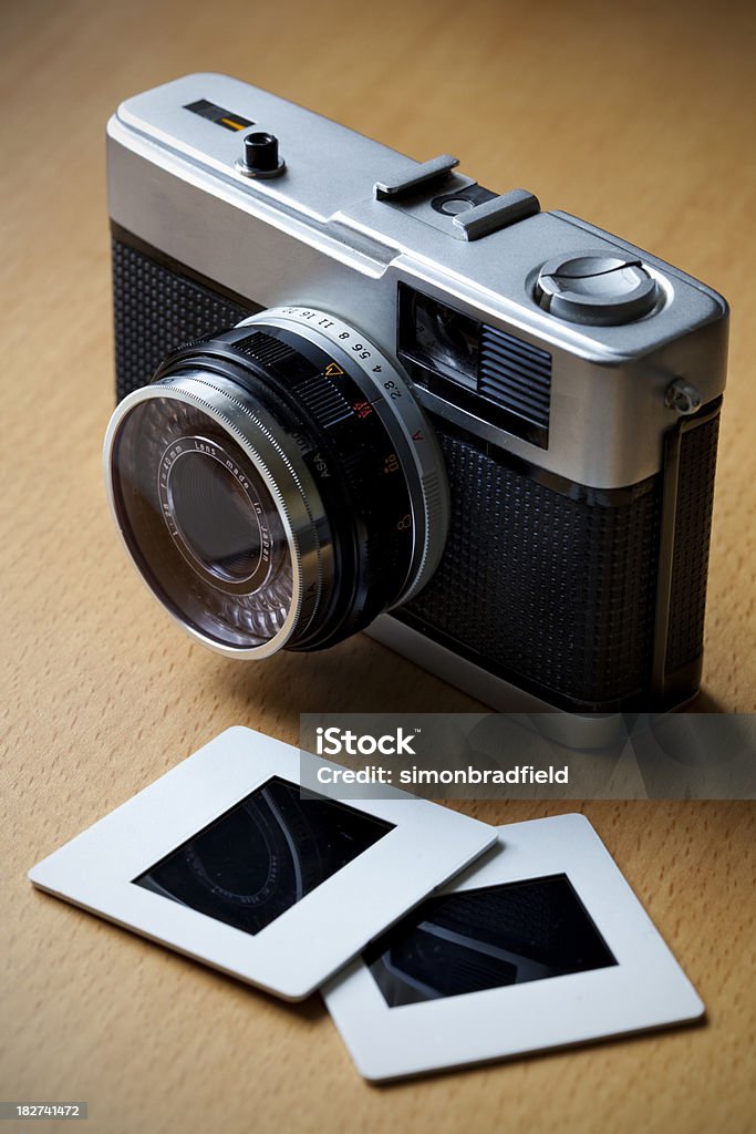 Retro Camera & Slides And old-style film camera and slides. Art Stock Photo
