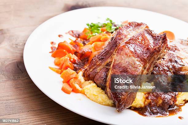 Foto de Carne Suína Assada Com Polenta Com Cenouras e mais fotos de stock de Porco Assado - Porco Assado, Polenta, Cenoura