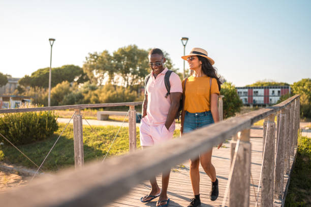 istock Cool Young Diverse Couple Enjoying a Beach Day Together 1827423044