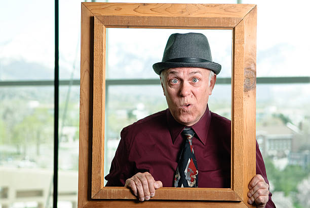 istock Cross eyed man holding a frame 182742353