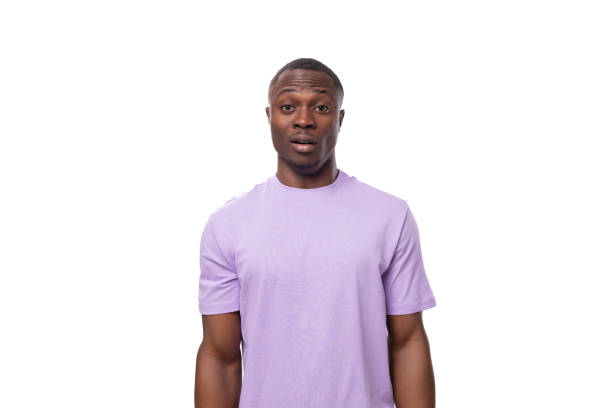 istock young surprised american guy dressed in a cotton t-shirt on a white background with copy space 1827425270