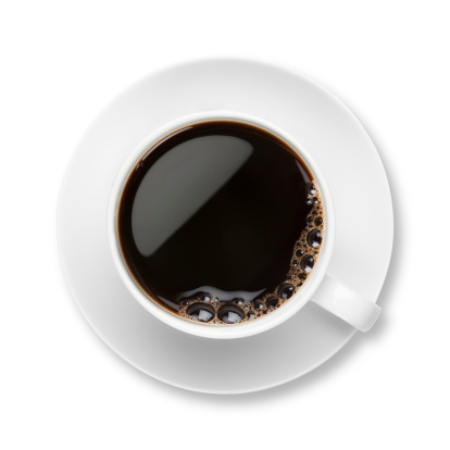Black Coffee in a white cup and saucer with bubbles