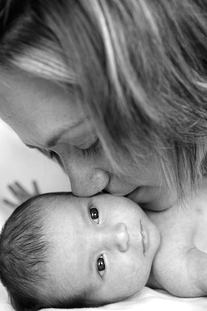 istock Mother Kissing Newborn 182742749