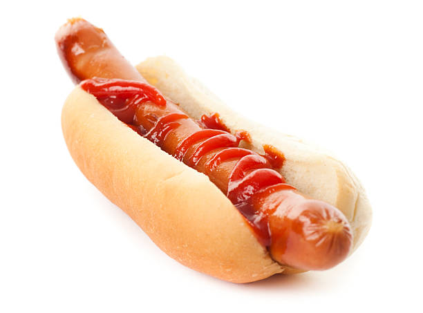 istock A hot dog on a bun with ketchup on a white background 182743216