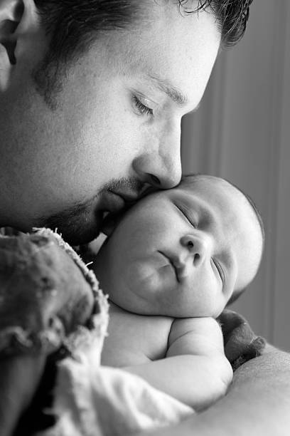 istock Father and Newborn 182744216