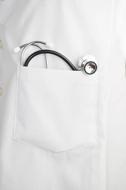 stethoscope In doctors lab coat pocket stock photo