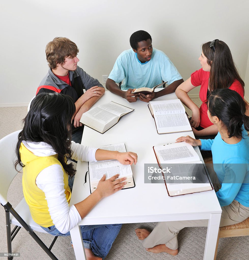 Bible study A youth Bible study with five diverse young adults - Buy credits Bible Stock Photo