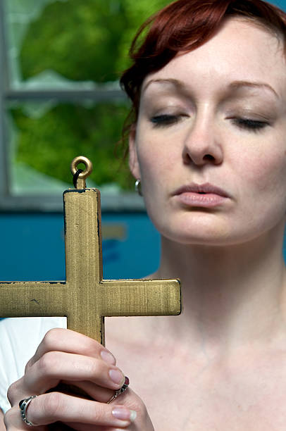 istock Girl with cross 182746207