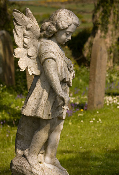 istock Angel statue in cemetery 182746259