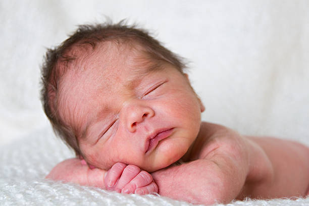 istock Baby relaxing on arms 182746378