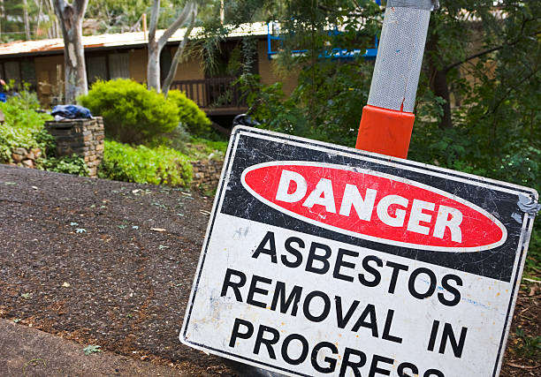 istock Roadside warning sign, asbestos removal in progress 182747138