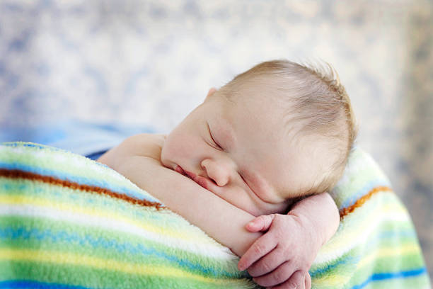 istock Newborn Baby Boy on Striped Blanket 182747283
