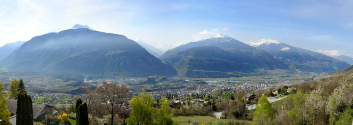 Stitched Panorama made of 6 pictures.Picture taken from Mollens over the town of Sierre in Valais. this big valley id the famous valley of RhA'ne river.