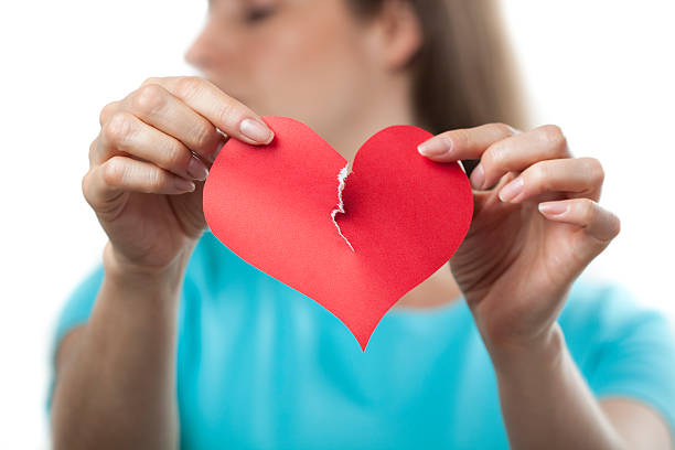 istock Tearing up a paper heart, breakup concept 182747598
