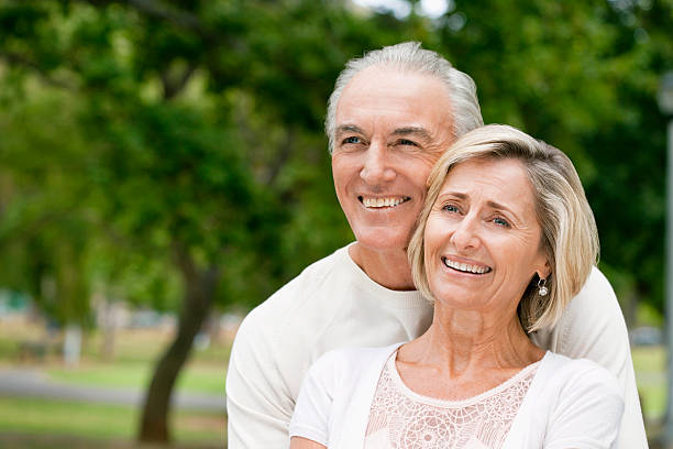 istock Smiling Senior Couple in a Park 182748440
