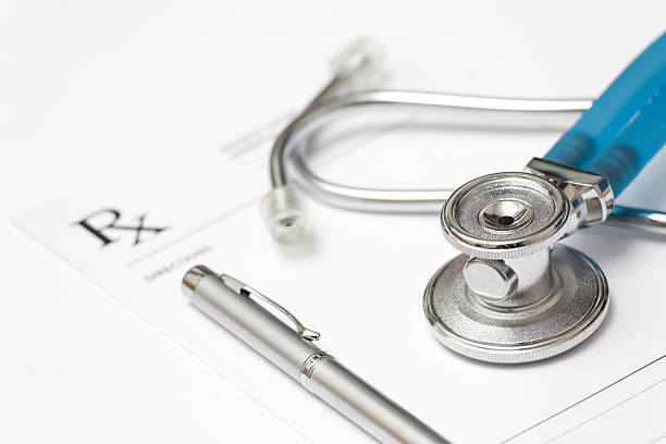 Stethoscope and prescription pad with pen stock photo