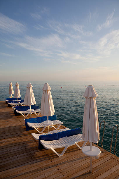istock Sunloungers  with white umbrellas 182748934