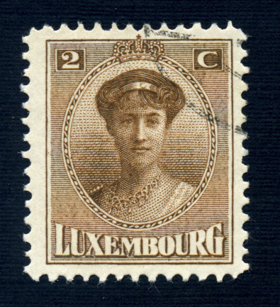 A two Centime Luxembourg postage stamp issued in 1918 featuring a young Grand Duchess Charlotte.