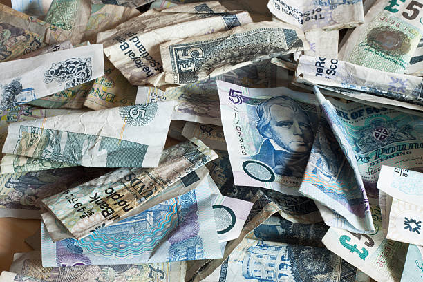 istock Pile of used banknotes. 182749364