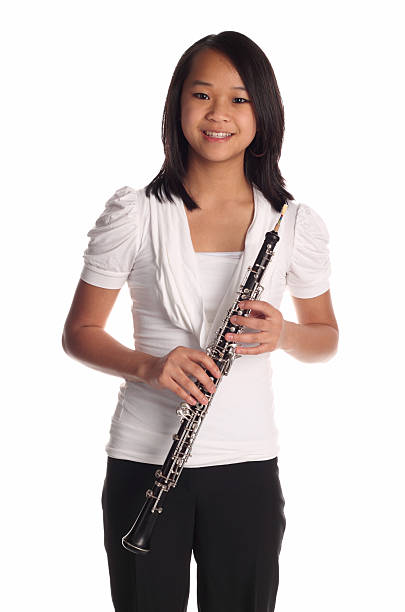 In a historic church, musicians deliver an enchanting concert with a focus on woodwind and string instruments. The atmosphere is enriched by festive decorations and the warm ambiance.