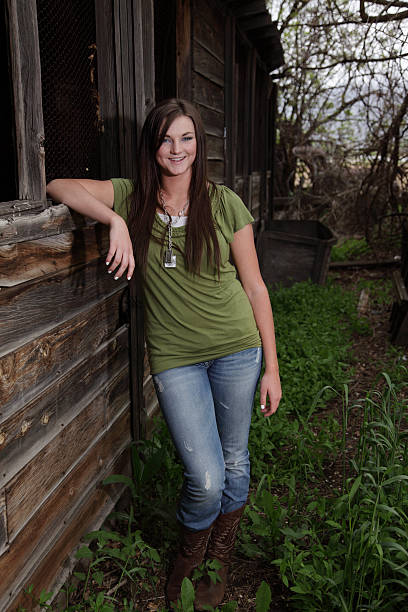 istock Teenager Standing Next To Old Barn 182751014
