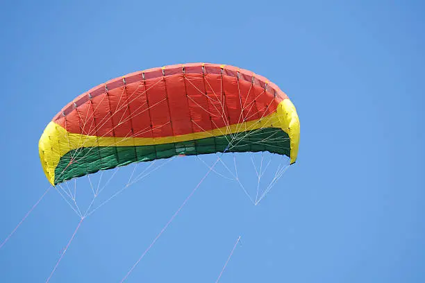 Colorful parachute agaginst clear sky