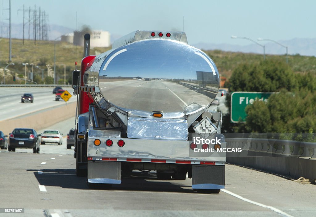 Tanker truck driving down Highway A tanker truck heads down the highway. Commercial Land Vehicle Stock Photo