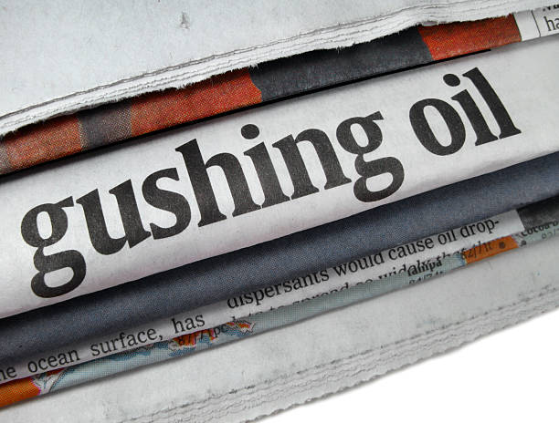 istock Oil Spill Newspaper Headline 182751945