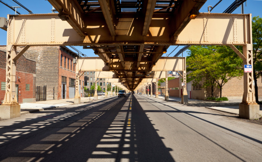 El Train's railway over almost empty street in Chicago Check out my Chicago Lightbox with more images: