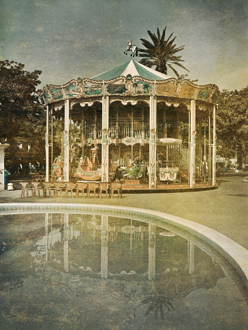 Old carousel, manipulated as an old, retro postcard. 