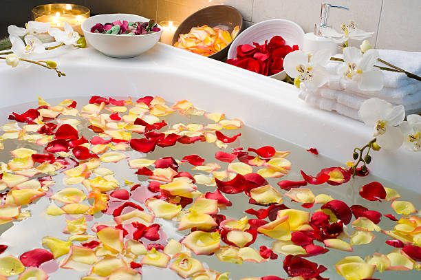 istock Spa bath with rose petals and candles 182752557