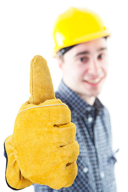 istock Young construction worker with yellow helmet doing thumb up 182752773