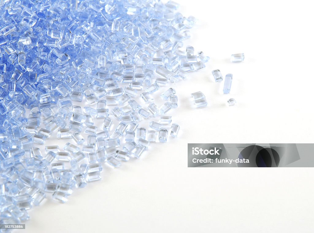 Plastic granules Light blue plastic granules. Focus on the mid section. Copy space available.  Molecule Stock Photo