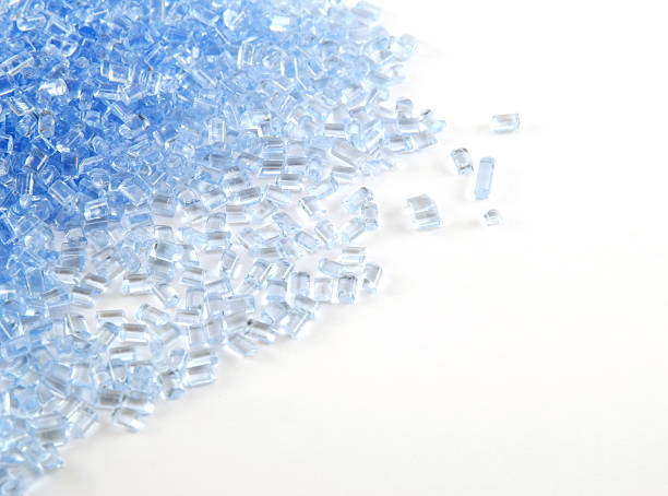 Plastic granules Light blue plastic granules. Focus on the mid section. Copy space available.  polymer photos stock pictures, royalty-free photos & images