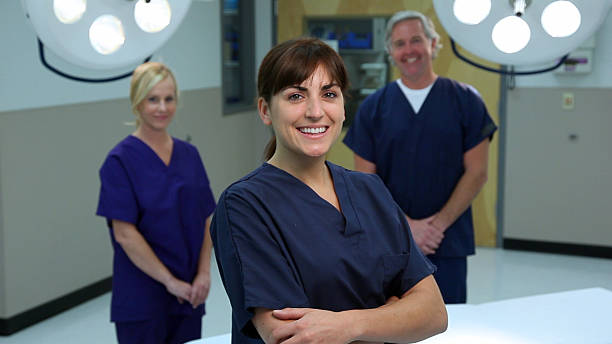 istock smiling surgical nurse and doctor 182754029