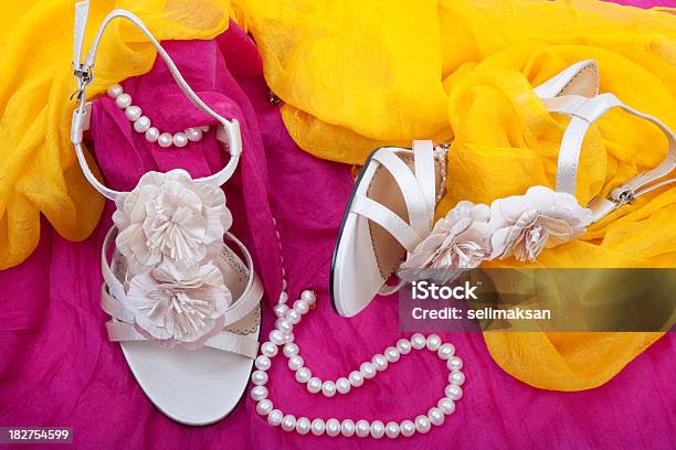 Wedding Shoes On Pink And Yellow Silk Stock Photo - Download Image Now - Bracelet, Celebration Event, Close-up
