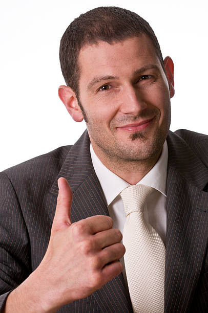 istock smiling businessman with thumb up 182754697