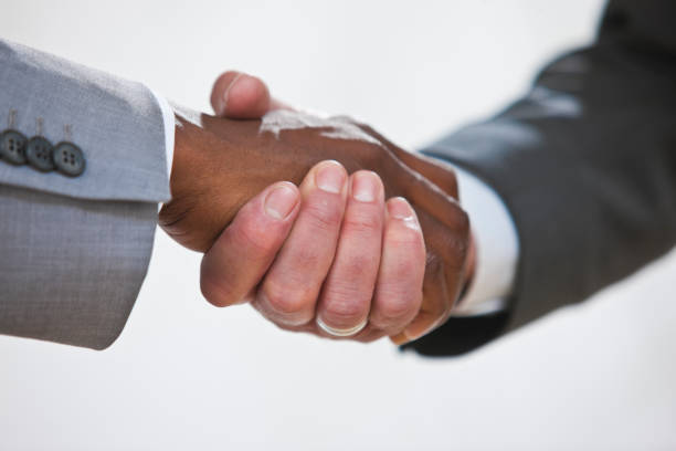 istock closeup of Handshake between colleagues 182754952
