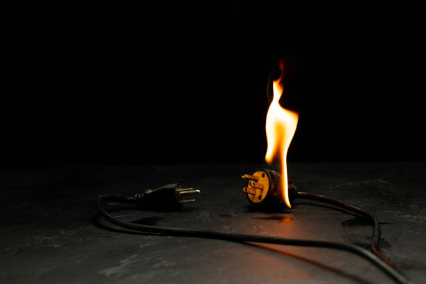 istock An electrical plug fire is caused by a short circuit of electrical current. Concept of prevention of danger. Using non-standard equipment, damaged equipment 1827556079