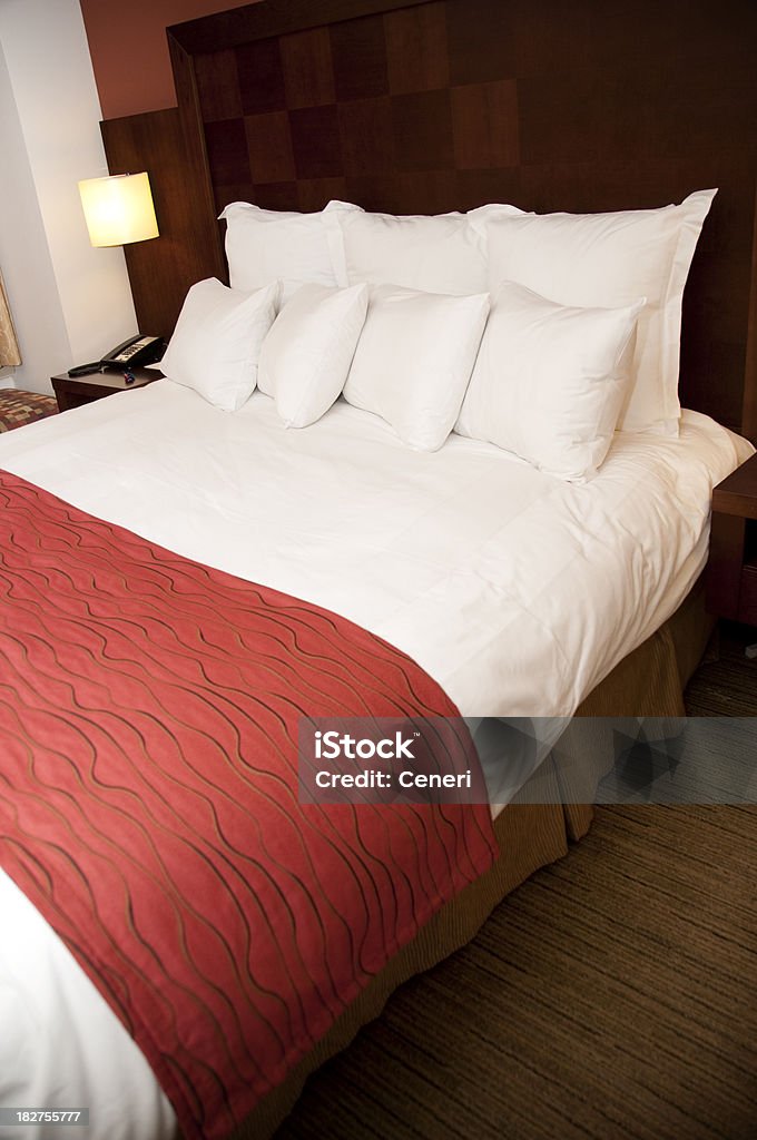 Comfort of a hotel bed The comfort of a hotel bed. Selective focus on the pillows. Related collections: Bed - Furniture Stock Photo