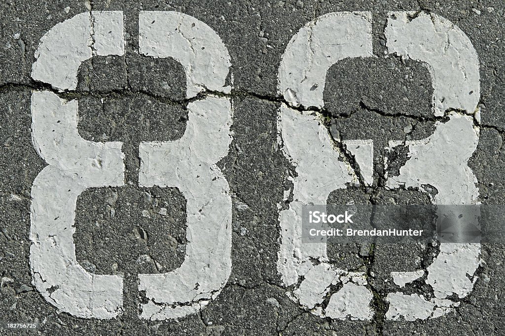 Eighty Eight The number 88 on asphalt. Asphalt Stock Photo