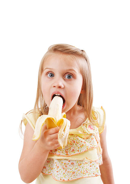 istock Little Girl Eating Banana 182756896