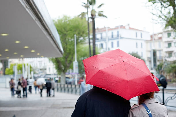 istock Pouring rain under red umbrella 182757144