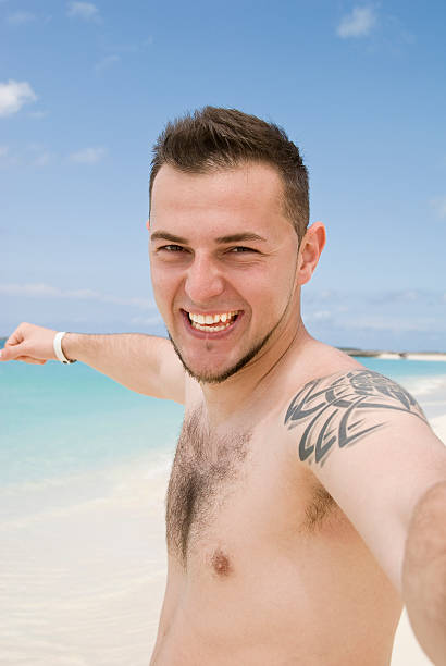 istock Happy man jumping on the beach 182757243