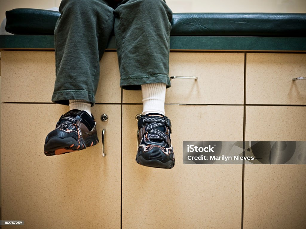 pediatric visit Child sitting down waiting for doctor. Annual Event Stock Photo